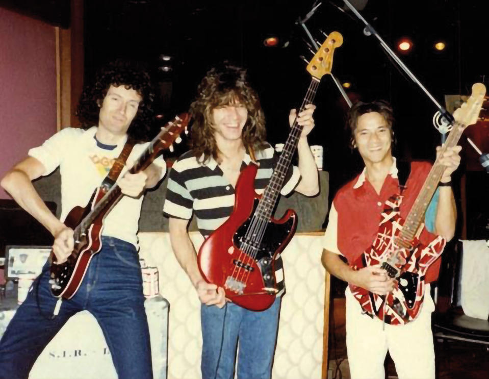 (from left) Brian May, Eddie Van Halen and Phil Chen pose in the studio while working on the Star Fleet Project