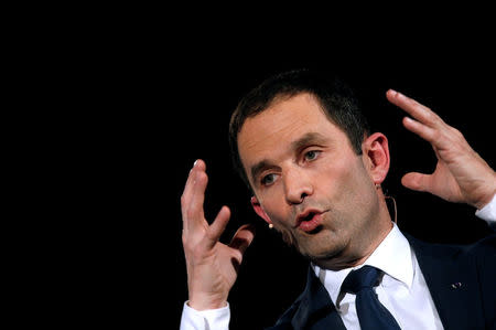 Benoit Hamon, French Socialist party candidate in their first-round presidential primary election, attends a political rally as he campaigns in Paris, France, January 18, 2017. REUTERS/Jacky Naegelen