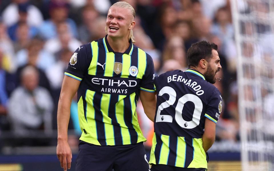 Erling Haaland and Bernardo Silva celebrate their opening goal