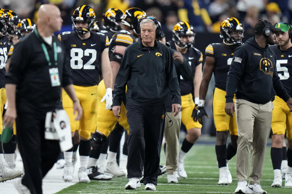 Iowa head coach Kirk Ferentz walks on the sideline during the first half of the Big Ten championship NCAA college football game against Michigan, Saturday, Dec. 2, 2023, in Indianapolis. (AP Photo/AJ Mast)