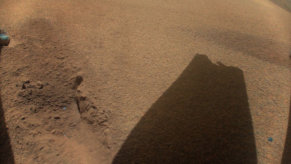 The helicopter took a photo of the shadow of a rotor blade that shows apparent damage from a rough landing on January 18. - NASA/JPL-Caltech