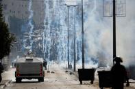 <p>Israeli forces clash with Palestinian protesters near an Israeli checkpoint in the West Bank city of Bethlehem on Dec. 7, 2017. (Photo: Thomas Coex/AFP/Getty Images) </p>