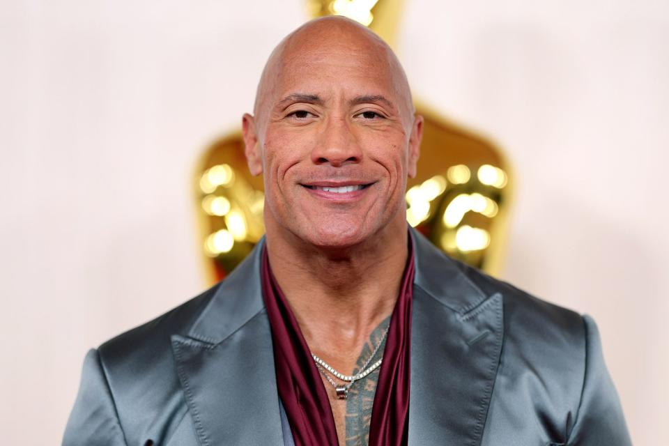 <p>Mike Coppola/Getty</p> Dwayne Johnson at the 2024 Academy Awards on March 10