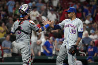 New York Mets relief pitcher Edwin Diaz (39) and catcher Tomas Nido celebrate a 4-3 victory over the St. Louis Cardinals in a baseball game Monday, May 6, 2024, in St. Louis. (AP Photo/Jeff Roberson)