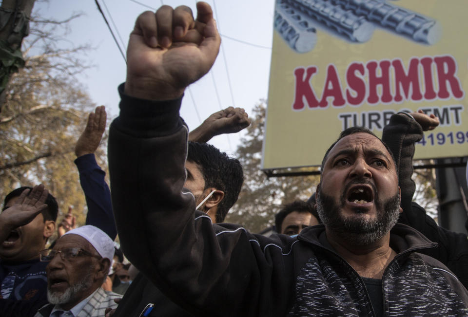 Activists of Peoples Democratic party (PDP) protesting against India's new land laws that allows any Indian citizen to buy land in the disputed region shout slogans in Srinagar, Indian controlled Kashmir, Thursday, Oct. 29, 2020. Until last year, Indians were not allowed to buy property in the region. But in August 2019, Prime Minister Narendra Modi’s government scrapped the disputed region’s special status, annulled its separate constitution, split the region into two federal territories. (AP Photo/Mukhtar Khan)