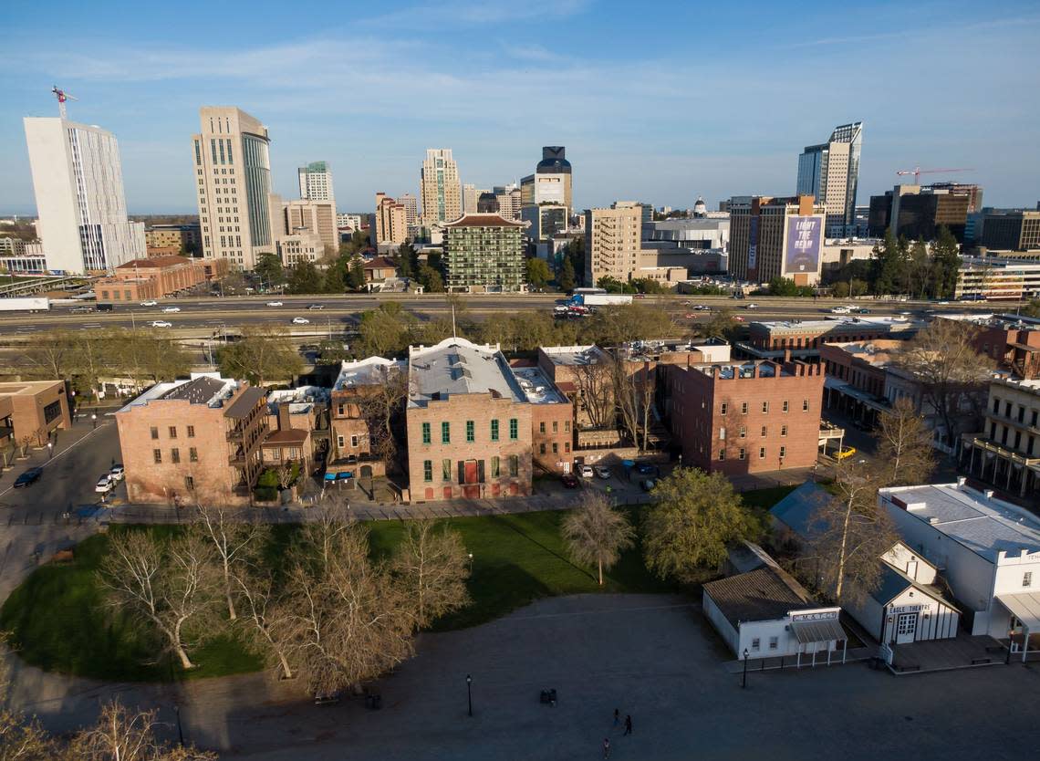 The downtown Sacramento skyline is seen past Interstate 5 over by drone Old Sacramento on April 5, 2023.