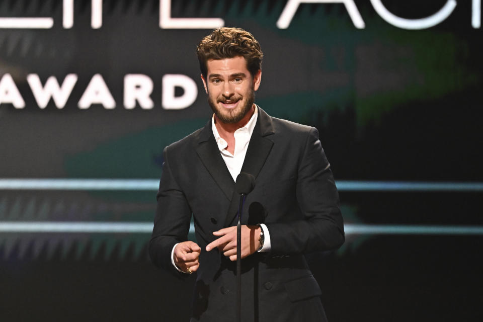 Andrew Garfield speaks on stage