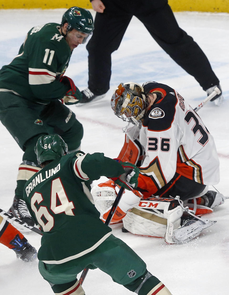 Minnesota Wild's Zach Parise, top, watches as Anaheim Ducks goalie John Gibson, right, smothers a shot in the second period of an NHL hockey game, Thursday, Jan. 17, 2019, in St. Paul, Minn. (AP Photo/Jim Mone)