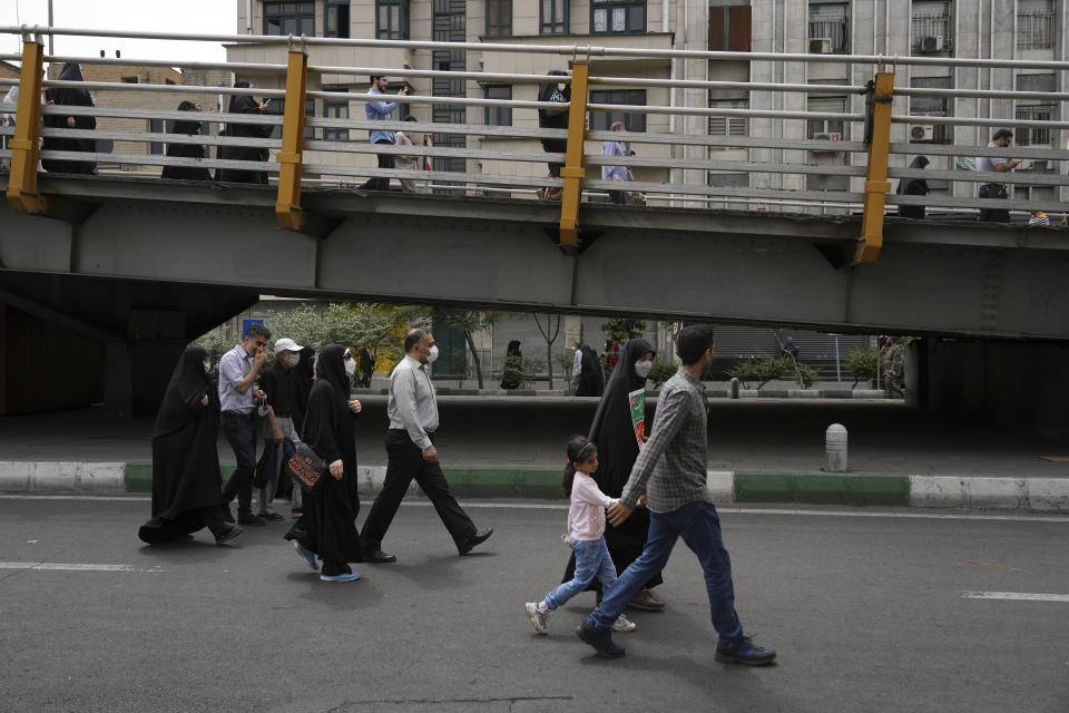 People attend the annual pro-Palestinian Al-Quds, or Jerusalem, Day rally in Tehran, Iran, Friday, April 29, 2022. Iran does not recognize Israel and supports Hamas and Hezbollah, militant groups that oppose it. (AP Photo/Vahid Salemi)