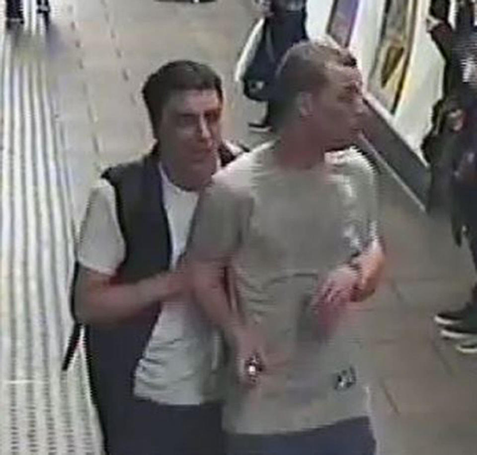 British Transport Police handout CCTV image of two men they will like to speak to following an incident where gas was released on board a train carriage at Oxford Circus station in London