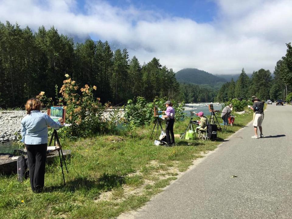 Recreationists in Index, WA take in the sights of the mountainside town.