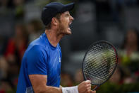 Andy Murray, of Britain, celebrates a point against Dominic Thiem of Austria during their match at the Mutua Madrid Open tennis tournament in Madrid, Spain, Monday, May 2, 2022. (AP Photo/Manu Fernandez)