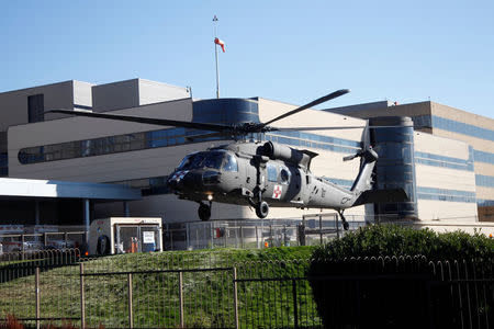 An Oregon Army National Guard Black Hawk helicopter lifts off after a rescue from Mount Hood, at Legacy Emanuel Medical Center in Portland, Oregon, U.S., February 13, 2018. REUTERS/Steve Dipaola