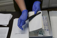 A Sexual Assault Evidence Collection Kit, or Rape Kit, is unpacked in an examination room, Wednesday, Aug. 31, 2022, in Austin, Texas. After a Texas law banning abortions past about six weeks, even in cases of rape or incest, went into effect a year ago, Gov. Greg Abbott said the state would strive to "eliminate all rapists from the streets." (AP Photo/Eric Gay)