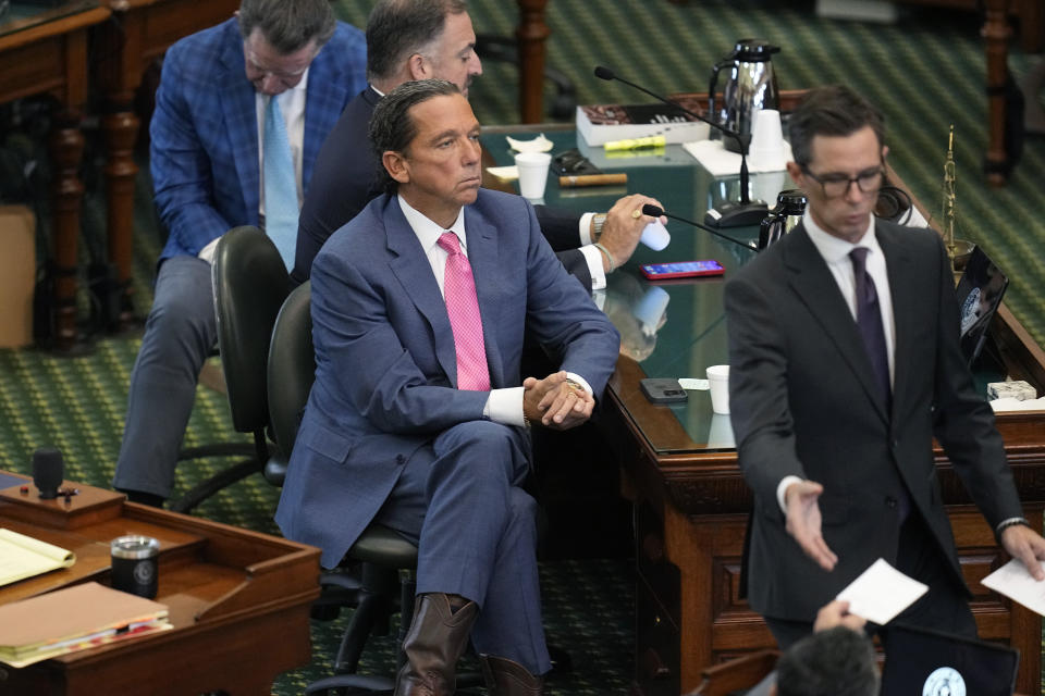 Defense attorney Tony Buzbee, left, watches as votes are collected during the impeachment trial for suspended Texas Attorney General Ken Paxton in the Senate Chamber at the Texas Capitol, Saturday, Sept. 16, 2023, in Austin, Texas. Paxton has been acquitted of all charges at his impeachment trial. (AP Photo/Eric Gay)