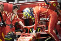 Ferrari driver Oliver Bearman of Britain boards his car prior to the start of the Formula One Saudi Arabian Grand Prix at the Jeddah Corniche Circuit, in Jedda, Saudi Arabia, Saturday, March 9, 2024. (AP Photo/Darko Bandic)