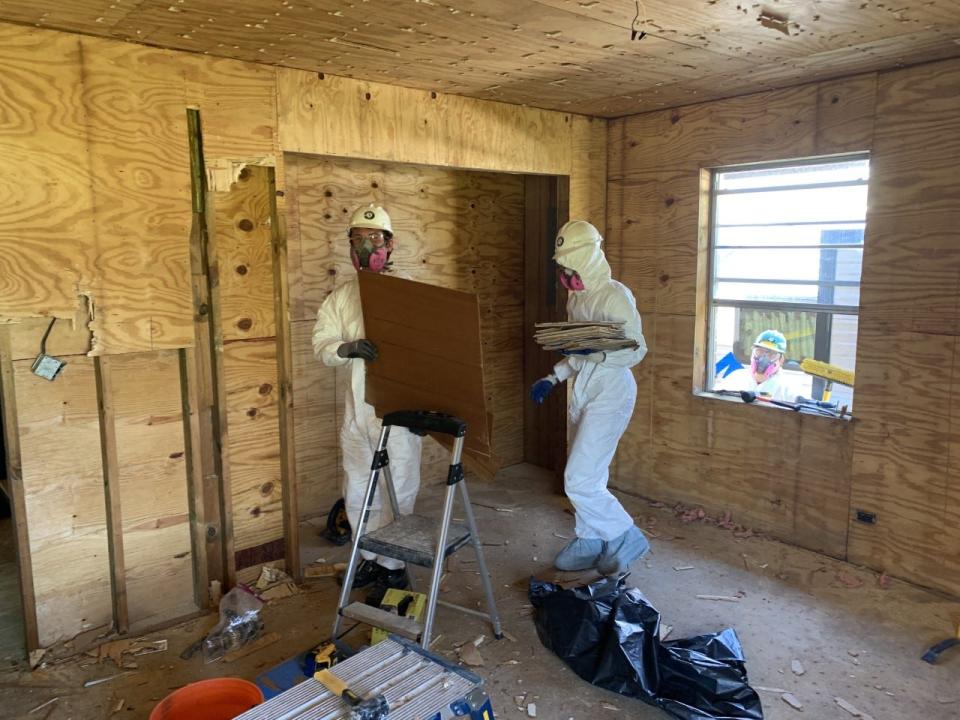 AmeriCorps volunteers are working with Catholic Charities this week to partially disassemble homes damaged by Hurricane Ida.