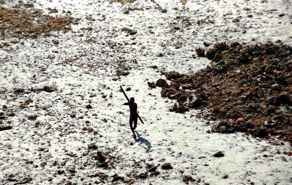 This member of the Sentinelese tribe was photographed firing arrows at a helicopter which was sent to check up on the tribe in the wake of a 2004 tsunami (Survival International)