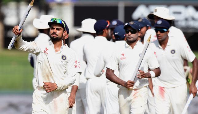 Virat Kohli and teammates celebrate after defeating Sri Lanka in Colombo.