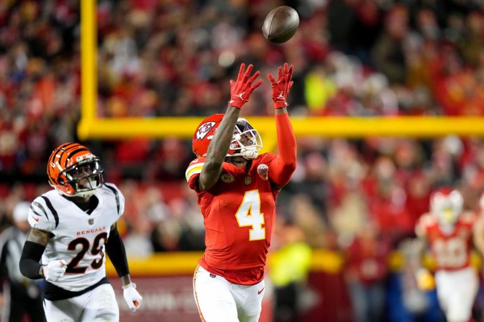 Kansas City Chiefs wide receiver Rashee Rice (4) catches a deep pass as <a class="link " href="https://sports.yahoo.com/nfl/teams/cincinnati/" data-i13n="sec:content-canvas;subsec:anchor_text;elm:context_link" data-ylk="slk:Cincinnati Bengals;sec:content-canvas;subsec:anchor_text;elm:context_link;itc:0">Cincinnati Bengals</a> cornerback <a class="link " href="https://sports.yahoo.com/nfl/players/34016/" data-i13n="sec:content-canvas;subsec:anchor_text;elm:context_link" data-ylk="slk:Cam Taylor-Britt;sec:content-canvas;subsec:anchor_text;elm:context_link;itc:0">Cam Taylor-Britt</a> (29) defends in the third quarter during a Week 17 NFL football game between the Cincinnati Bengals and the Kansas City Chiefs, Sunday, Dec. 31, 2023, at GEHA Field at Arrowhead Stadium in Kansas City, Mo. The Kansas City Chiefs won, 25-17.