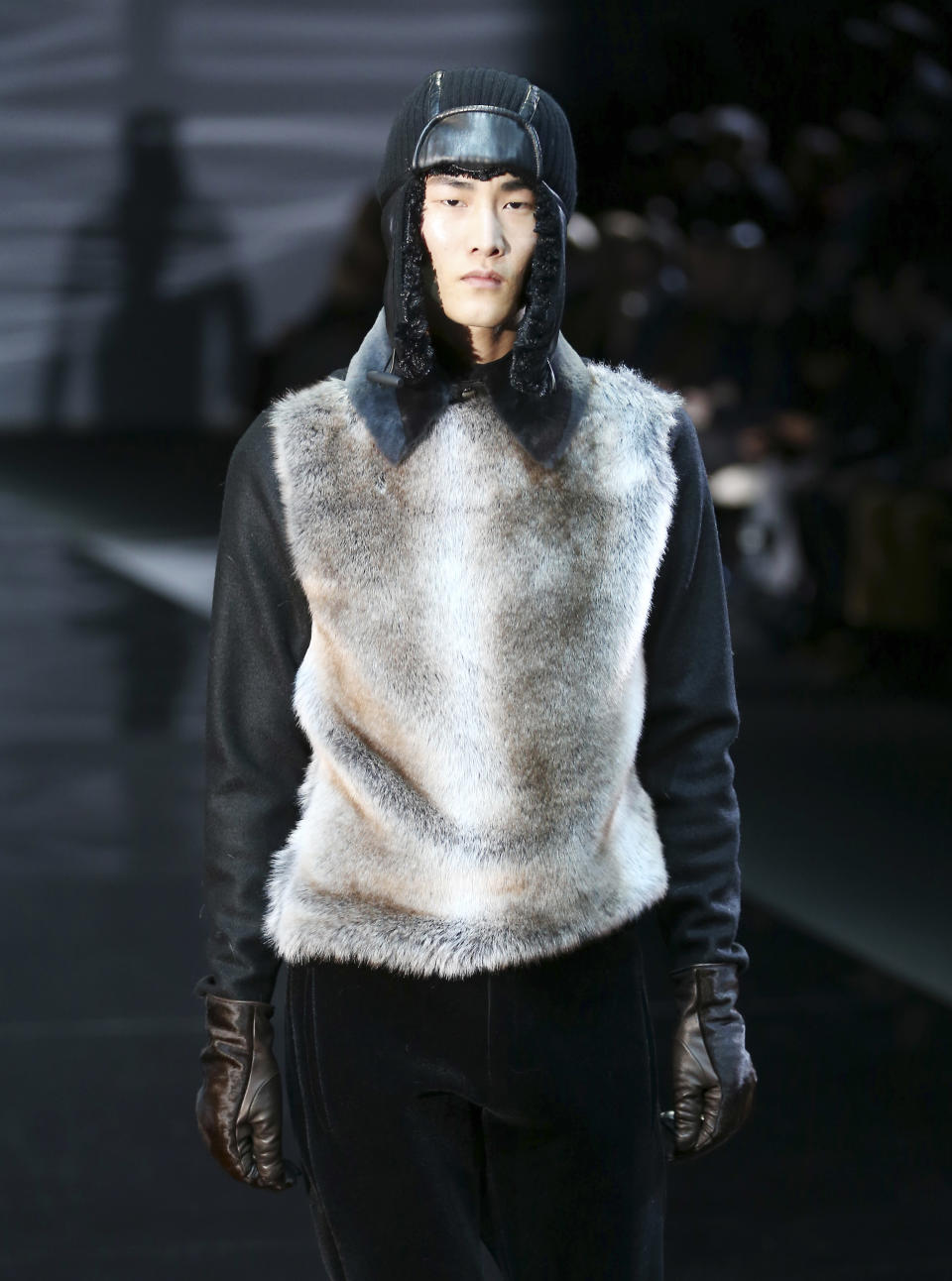A model wears a creation for Emporio Armani men's Fall-Winter 2014 collection, part of the Milan Fashion Week, unveiled in Milan, Italy, Monday, Jan. 13, 2014. (AP Photo/Antonio Calanni)