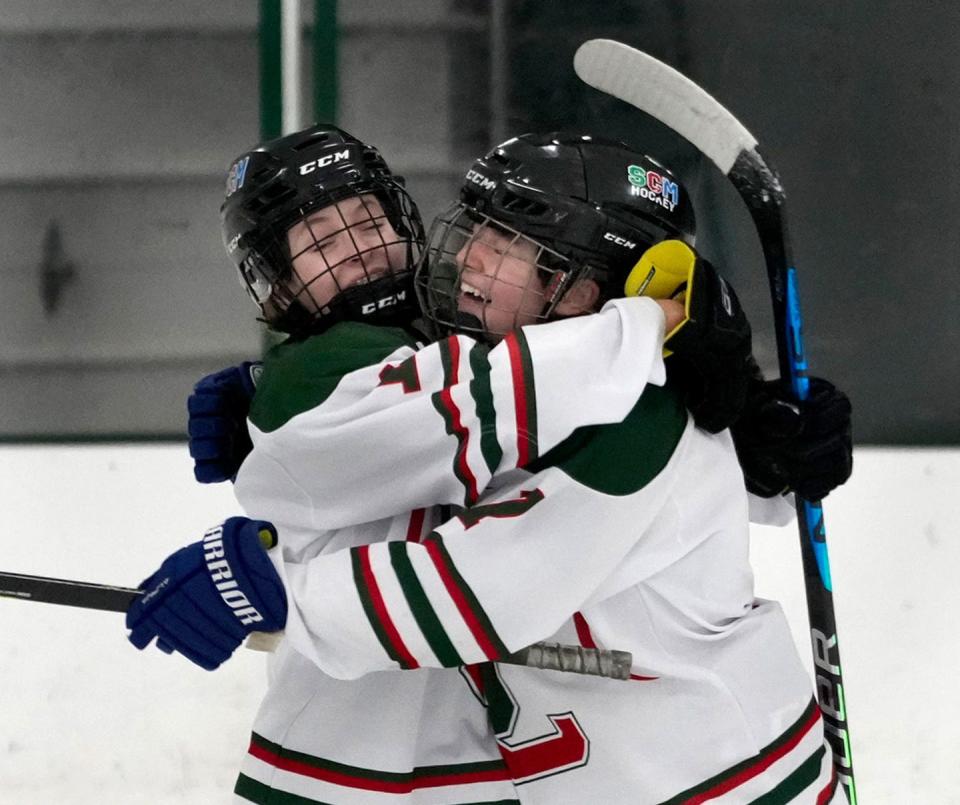 Smithfield's Kaylin O'Connor, left, and Keira Goffe hope to be celebrating this weekend during the girls hockey state tournament playoffs.