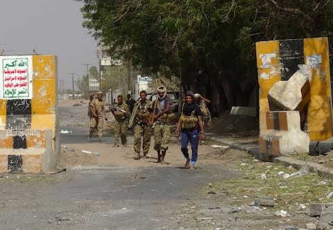 Yemeni pro-government forces gather on the eastern outskirts of Hodeida as they continue to battle for the control of the city from Huthi - Credit: STRINGER/AFP/Getty Images