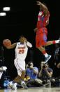 Florida guard Michael Frazier II (20) moves the ball by Dayton guard Jordan Sibert (24) during the first half in a regional final game at the NCAA college basketball tournament, Saturday, March 29, 2014, in Memphis, Tenn. (AP Photo/John Bazemore)
