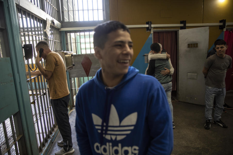 Prisoners spend their recreational time in a common area of an evangelical cellblock at the Penal Unit in Pinero, Santa Fe province, Argentina, Thursday, Nov. 18, 2021. Prison authorities have encouraged the creation of units effectively run by evangelical inmates, sometimes granting them a few extra special privileges. (AP Photo/Rodrigo Abd)