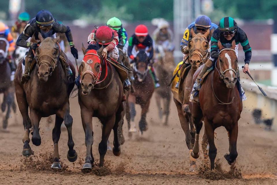 Mystik Dan, right with Brian Hernandez Jr. up, wins the 150th running of the Kentucky Derby.