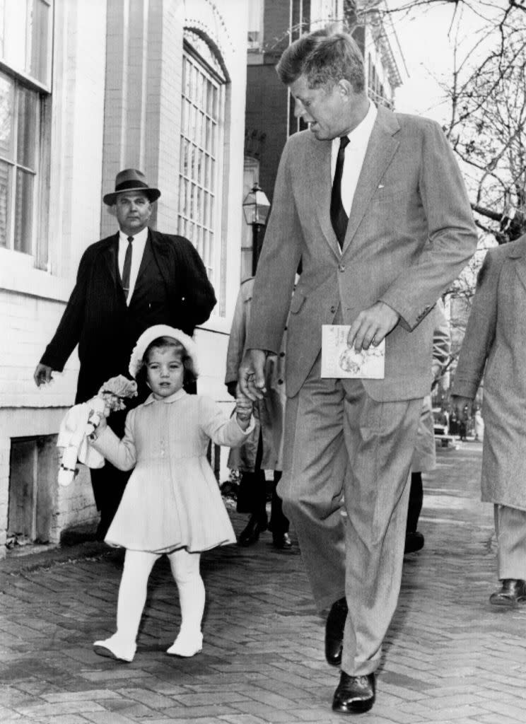 <p>President-elect Kennedy walks with Caroline on their way to church services on her third birthday in November.</p>