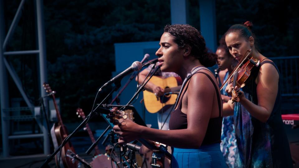 Leyla McCalla sings during a performance with Our Native Daughters.