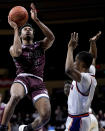 Freed-Hardeman guard Geraldo Lane (4) shoots during the first half of the NAIA men's national championship college basketball game against Langston, Tuesday, March 26, 2024, in Kansas City, Mo. (AP Photo/Charlie Riedel)