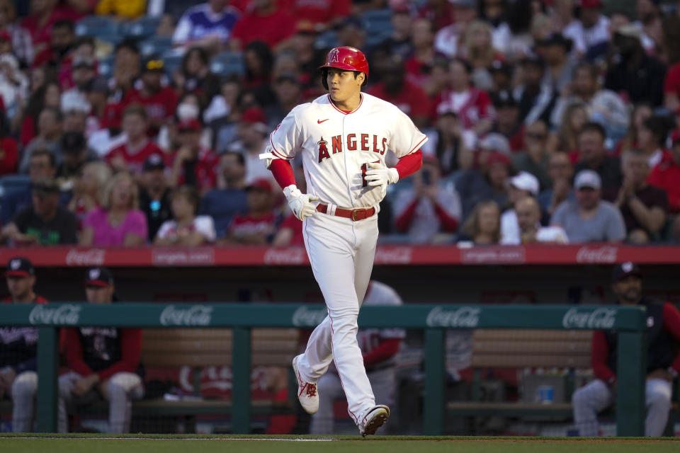 Los Angeles Angels designated hitter Shohei Ohtani (17) returns to the dugout after grounding out during the first inning of a baseball game in Anaheim, Calif., Friday, May 6, 2022. (AP Photo/Ashley Landis)