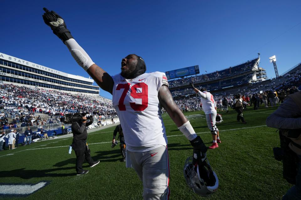 Ohio State offensive linemen Dawand Jones (79) waves to the fans after the Buckeyes defeated Penn State 41-33 at Beaver Stadium on Oct. 29, 2022.