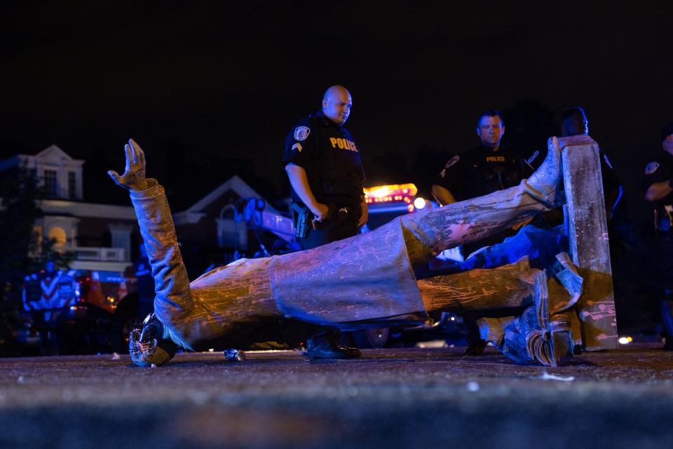 In this file photo a statue of Confederate States President Jefferson Davis lies on the street after protesters pulled it down in Richmond, Virginia, on June 10, 2020.  (Parker Michels-Boyce/AFP via Getty Images)