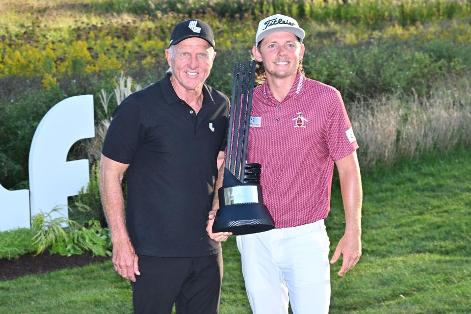 LIV Golf CEO Greg Norman, left, poses with Cameron Smith, the winner of the Invitational Chicago LIV Golf tournament at Rich Harvest Farms.