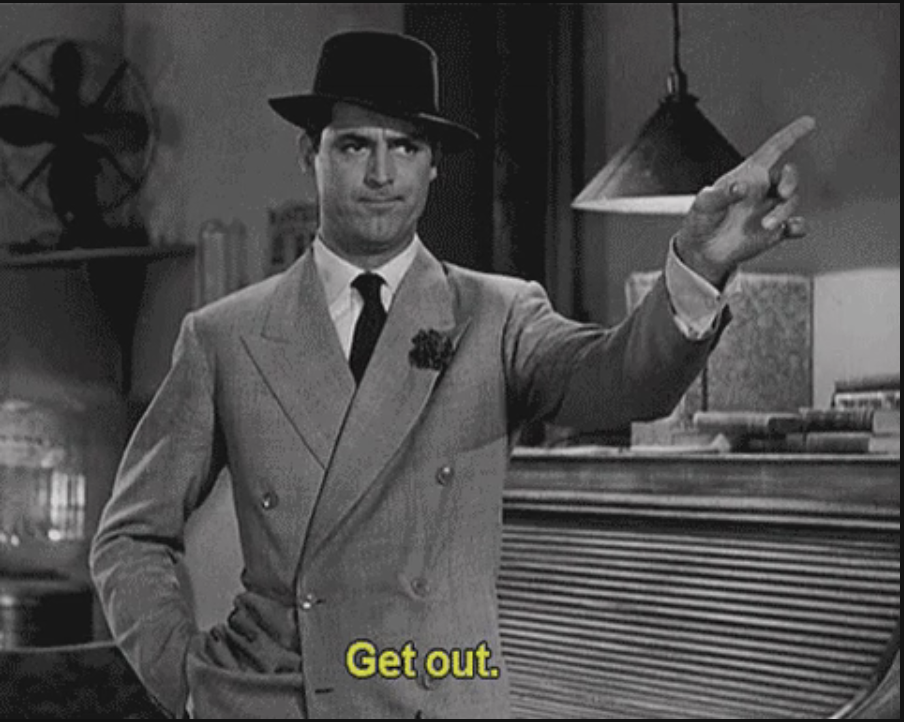 Man in a suit and hat pointing towards the door with the text "Get out."