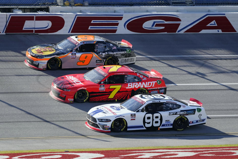 Chase Briscoe (98) races against Justin Allgaier (7) and Noah Gragson (9) during a NASCAR Xfinity Series auto race at Talladega Superspeedway Saturday, Oct. 3, 2020, in Talladega, Ala. (AP Photo/John Bazemore)