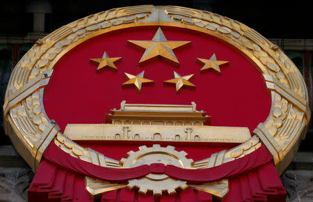 A Chinese national emblem is seen during a news conference ahead of the opening session of the Chinese People's Political Consultative Conference (CPPCC) at the Great Hall of the People in Beijing, China, March 2, 2017. REUTERS/Thomas Peter