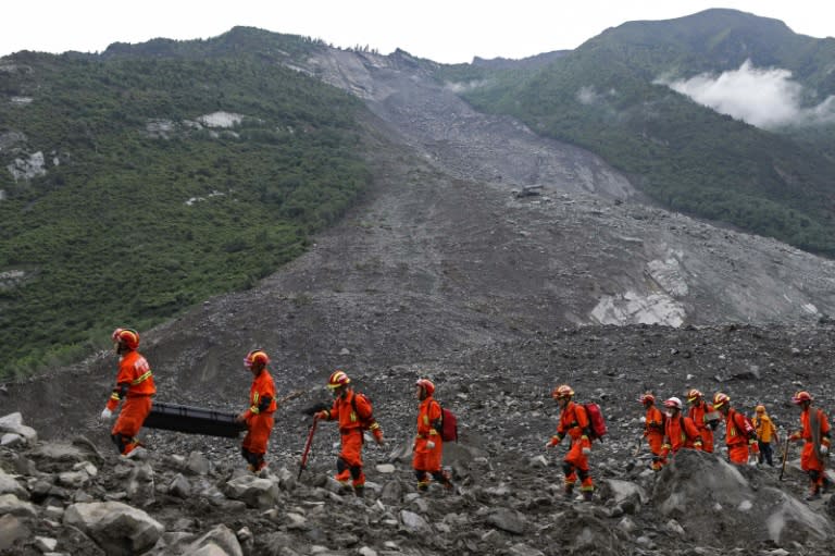 The confirmed number of dead remained at 10 after heavy rain brought down the side of a mountain on to Xinmo village in Sichuan province on Saturday