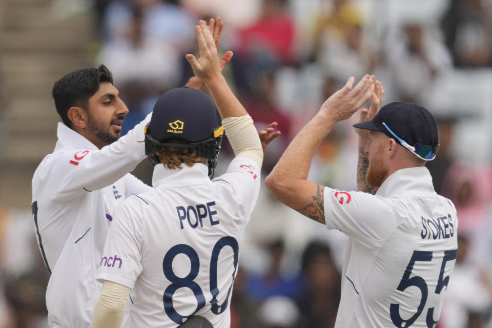 England's Shoaib Bashir, left, celebrates the wicket of India's Akash Deep adn his fifth on the third day of the fourth cricket test match between England and India in Ranchi, India, Sunday, Feb. 25, 2024. (AP Photo/Ajit Solanki)