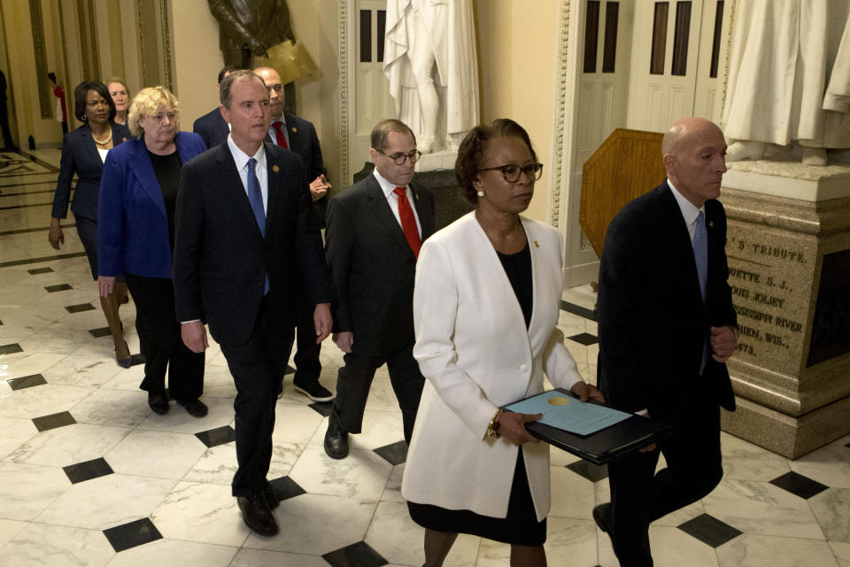 House Sergeant at Arms Paul Irving and Clerk of the House Cheryl Johnson deliver the articles of impeachment against President Donald Trump to Secretary of the Senate Julie Adams on Capitol Hill in Washington, Wednesday, Jan. 15, 2020. Following are impeachment managers, House Judiciary Committee Chairman, Rep. Jerrold Nadler, D-N.Y., House Intelligence Committee Chairman Adam Schiff, D-Calif., Rep. Hakeem Jeffries, D-N.Y., Rep. Sylvia Garcia, D-Texas, Rep. Val Demings, D-Fla., Rep. Zoe Lofgren, D-Calif., and Rep. Jason Crow, D-Colo. (AP Photo/Jose Luis Magana, Pool)