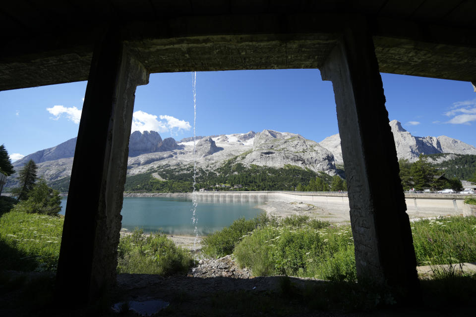A vie of the Marmolada mountain and the Punta Rocca glacier near Canazei, in the Italian Alps in northern Italy, Wednesday, July 6, 2022, where an avalanche broke loose on Sunday, sending tons of ice, snow, and rocks onto hikers. (AP Photo/Luca Bruno)
