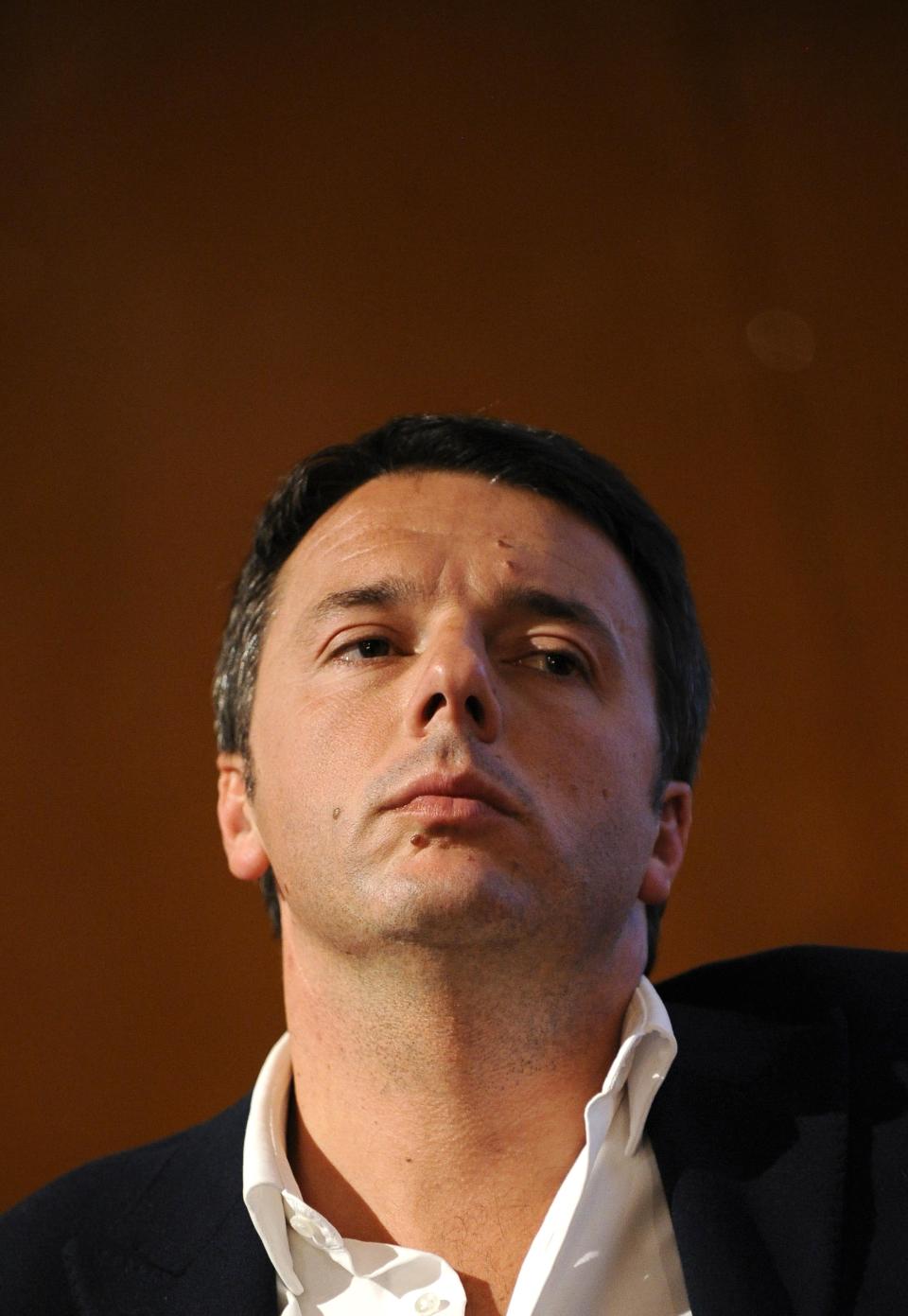 Florence mayor Matteo Renzi looks on during a political meeting in Turin