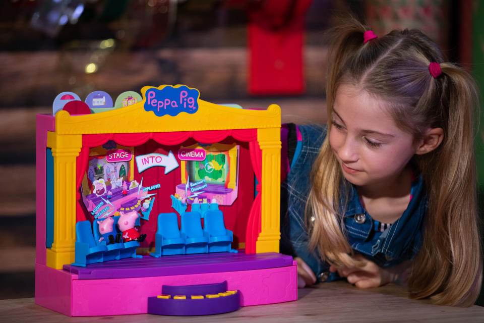 Liana Pierce, 7, plays with a Peppa Pig Peppa's Stage playset by Character Options, which was named in the top 12 to buy during the unveiling of the annual DreamToys list at St Mary's Church in Marylebone, London. (Photo by Aaron Chown/PA Images via Getty Images)