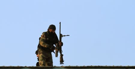 A soldier packs up his gun after taking part in a security operation on the outskirts of Peshawar, Pakistan June 24, 2017. REUTERS/ Fayaz Aziz