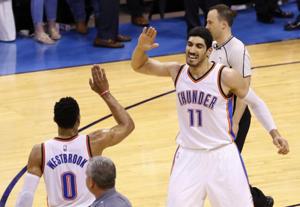 Enes Kanter celebrates with Thunder teammate Russell Westbrook during Game 6 of the 2016 Western Conference Semifinals. (AP/Alonzo Adams)