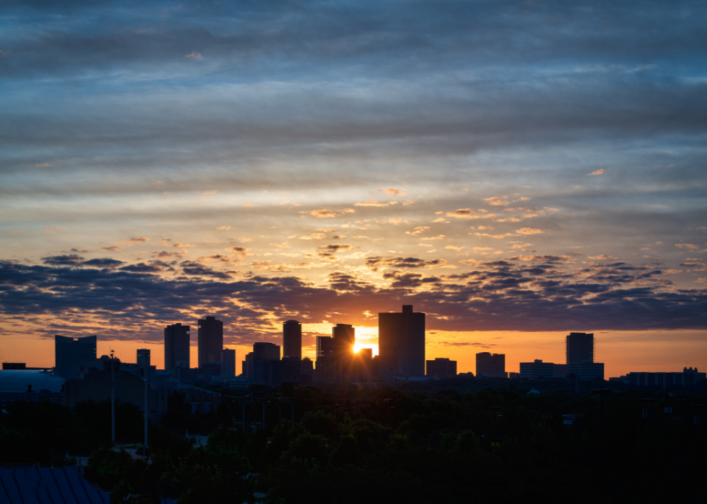 A city skyline at sunset.