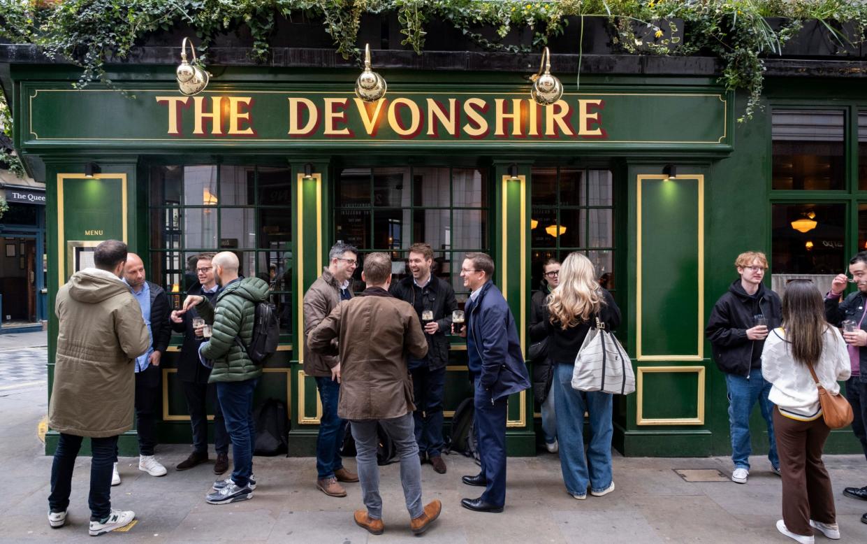 People drinking outside The Devonshire pub